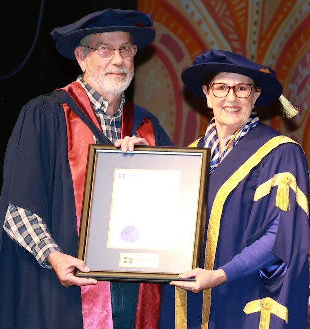 Peter Weir receives his PhD testamur from Deputy Chancellor Rhonda Whitfield